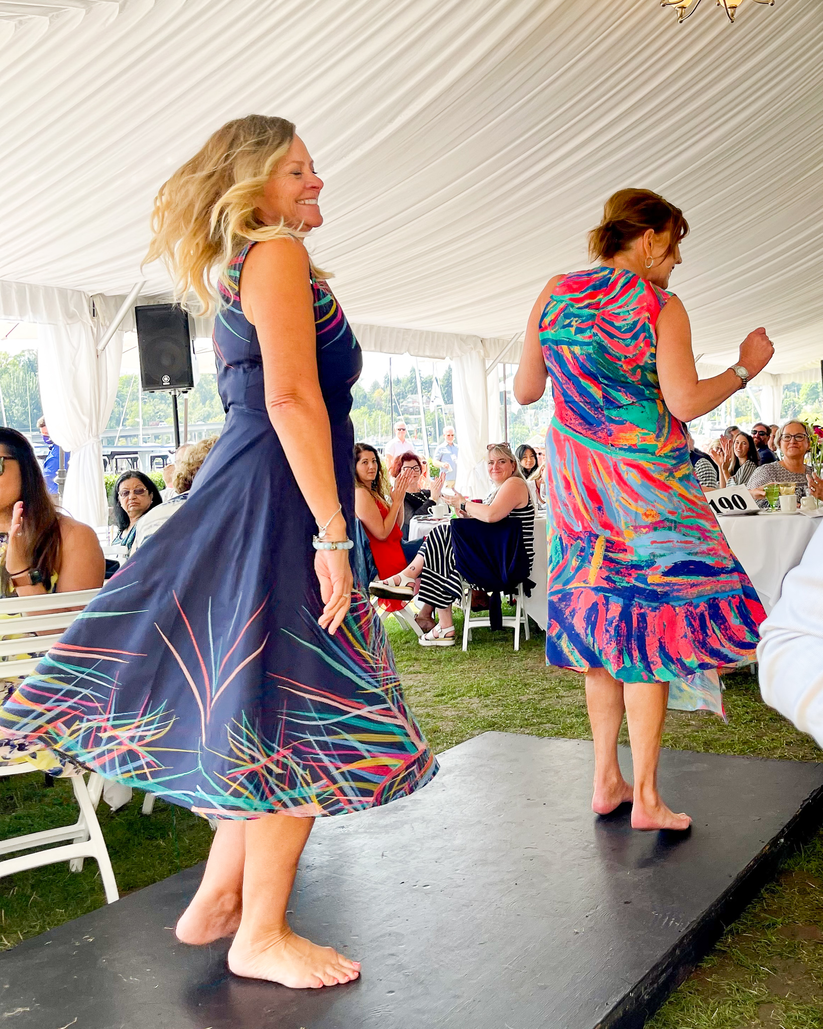 Two models twirling in sun dresses