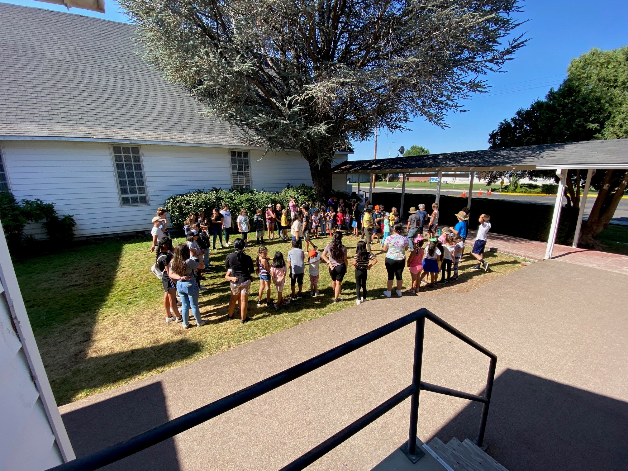 STEM Campers gathered around in a circle to learn about the activities