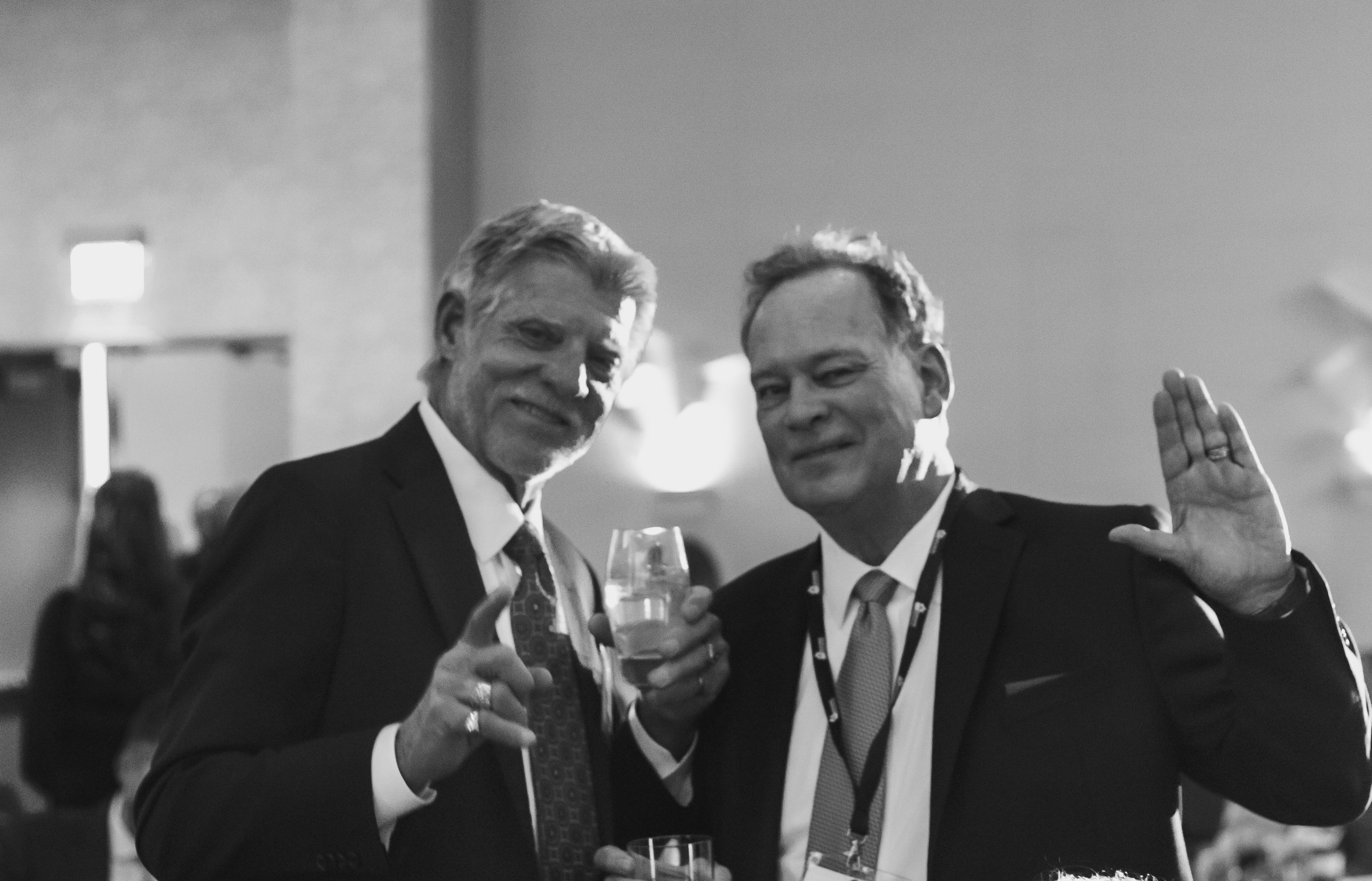 A black and white photo of George Newman and Tom Barghausen posing at the Master Builders Association (MBA) of King and Snohomish counties Installation of Officers ceremony at the W Hotel in Bellevue, WA.